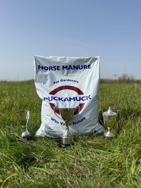Puckamuck 30 litre sack surrounded by trophies